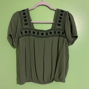 Green square neck blouse.